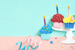 © Marc Tran/Stocksy - Happy birthday cupcakes paper craft.