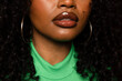 © VICTOR TORRES/Stocksy - Unrecognizable black woman with curly hair and big round earrings