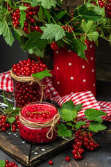 Wall Mural - Homemade Red Currant Jam with fresh fruits on wooden table. vertical image. top view. place for text