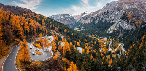 Wonderful Nature landscape of Switzerland. Vivid autumn scenery of Maloja pass, Switzerland, Europe. Amazing, serpentine road is a most popular place of travel and Outdoor vacations in Swiss alps.