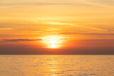 Fototapeta Niebo - sunset on the sea, seascape, the sun sets behind the clouds