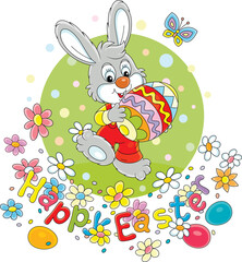 Wall Mural - Easter card with a happy little bunny carrying a painted gift egg through a pretty spring lawn with colorful flowers and a merrily fluttering butterfly, vector cartoon illustration