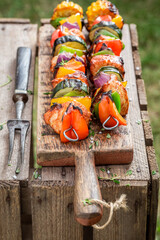 Wall Mural - Homemade and delicious grilled skewers made of vegetables and meat.