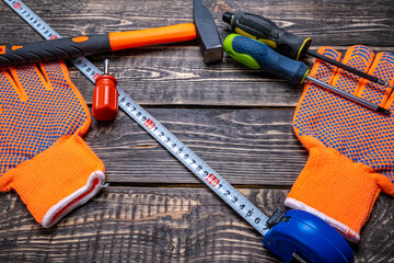 The tools lie on a wooden background with a place to copy.