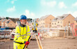 © Iryna - Surveyor builder site engineer with theodolite total station at construction site outdoors during surveying work
