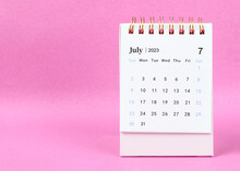 The July 2023 Desk Calendar On Pink Color Background.