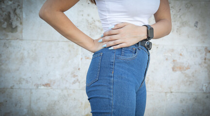 Wall Mural - Caucasian young woman wearing blue jeans.