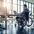 © MiguelAngel - Man on wheelchair working in the office, next to a desk with a laptop, Ai Generative.