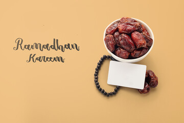 Wall Mural - Dates fruit in brown background with ramadhan kareem text and white card for template space