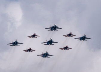 Wall Mural - MOSCOW, RUSSIA - MAY 7, 2021: Avia parade in Moscow. group jet fighter aircraft MiG-35 and Su-30 in the sky on parade of Victory in World War II in Moscow, Russia