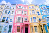 Fototapeta Londyn - Colorful pastel houses of Notting Hill, London, England. Upward street view.