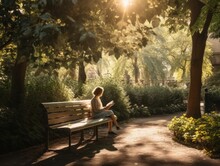 A Person Sitting On A Bench In A Serene Park, Reading A Book. The Image Captures The Peaceful Atmosphere And The Joy Of Reading, With The Person's Face Hidden Behind The Book.