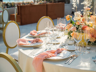 Wall Mural - Table at luxury wedding reception event. Beautiful flowers on table and serving dishes and glasses and decoration