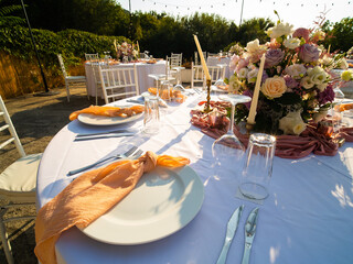 Wall Mural - Table at luxury wedding reception event. Beautiful flowers on table and serving dishes and glasses and decoration