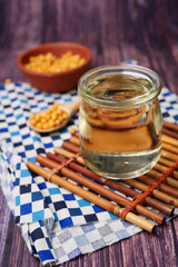 Canvas Print - close up of Raw soy bean seed oil in a container 