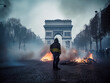 A French protester facing the Arc de Triomphe during a riot in Paris, barricades burning in the street - generative AI