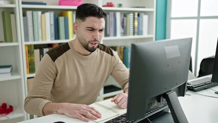 Sticker - Young arab man student tired studying with computer at university classroom