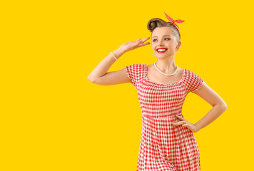 Poster - Young pin-up woman on yellow background