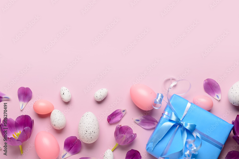 Easter eggs with gift and tulips on pink background