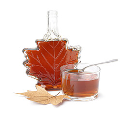 Wall Mural - Bottle and glass of tasty maple syrup on white background