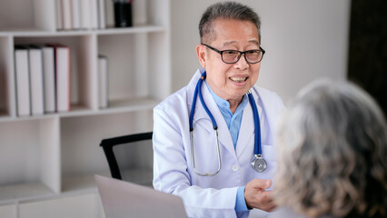 Wall Mural - Male doctor writing prescription on clipboard while explaining m