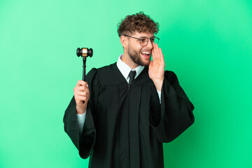 Canvas Print - Judge over isolated green background shouting with mouth wide open to the side