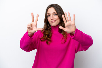 Wall Mural - Young caucasian woman isolated on white background counting eight with fingers