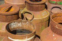 Old Historic Rusty Milk Canisters In Orvelte, Netherlands