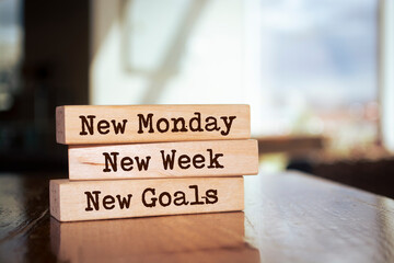Wooden blocks with words 'New Monday New Week New Goals'.