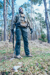 Wall Mural -  Soldier in a trench. Member of the International Legion patrols. The war in Ukraine.Army soldier Patrolled the front line