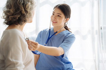 doctor measure heart rate by stethoscope on older patient. Medical insurance service concept.