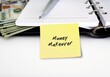 Pen notebook cash dollar money on white background with notepad written MONEY MAKEOVER - to transform financial situation and establish healthy spending, saving , investing - with a plan to back it up