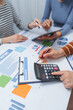 © Kannikar - small business accounting team meeting three asian people with salary monthly charts data, basic business accounting and bookkeeping concept.