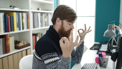 Poster - Young redhead man student doing yoga exercise relaxing at library university