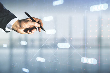 Wall Mural - male hand with pen working with abstract virtual coding concept on blurred office background. multie