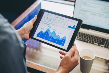 Wall Mural - Businessman analyzing company financial cash flow result. Concept for business strategy and economy fund data analysis.