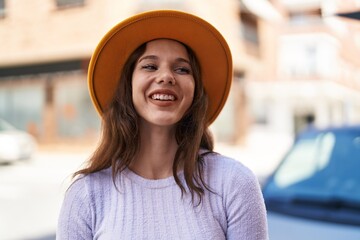 Sticker - Young woman smiling confident wearing hat at street