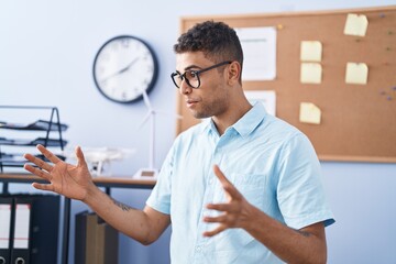 Wall Mural - African american man business worker smiling confident speaking at office