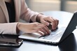 © OLKS_AI - Business woman hands typing on laptop computer, surfing the internet, online working from home office with mobile phone, digital tablet on office table, freelancer at work, telecommuting concept