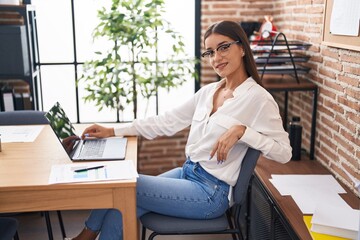 Poster - Young beautiful hispanic woman business worker using laptop working at office