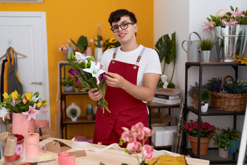 Poster - Non binary man florist holding bouquet of flowers at flower shop