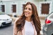 © Krakenimages.com - Young hispanic woman smiling confident walking at street