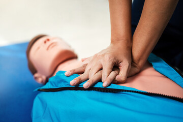 Wall Mural - CPR Training ,Emergency and first aid class on cpr doll, Cardiopulmonary resuscitation, One part of the process resuscitation on unconscious person.