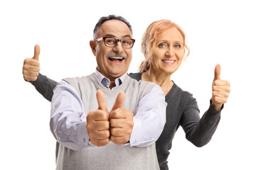 Poster - Happy mature woman behind a cheerful man gesturing thumbs up