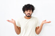 © kucherav - Puzzled young Indian man with curly hair in white shirt shrugging shoulders spread hands standing on white background