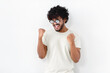 © kucherav - Happy ecstatic cheerful Asian man with curly hair in white t-shirt and glasses shouting yeah celebrate winning on white background
