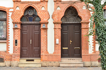 Wall Mural - View of brick building with wooden doors