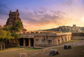 Wall Mural - Ancient medieval architecture of Raghunatha Temple at sunset built in the 16th century CE at Hampi Karnataka, India