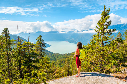 hiking woman at viewpoint in amazing nature landscape mountain hike. aspirational outdoor lifestyle 