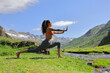 © Antonioguillem - Female exercising tai chi in the mountain